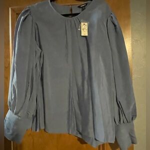 Express round neck blouse with balloon sleeves.